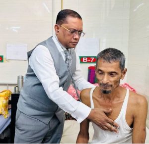 Professor AKM Manzurul Alam checking the patient's heart
