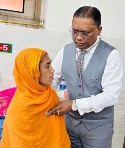 Professor AKM Manzurul Alam checking his patient's heart