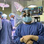 a cardiac surgeon with staff are doing surgery